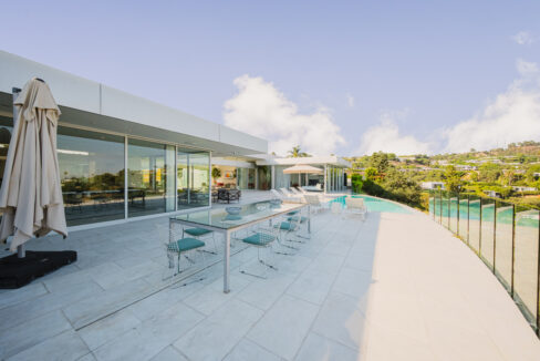 Loma Coastal Beverly Hills luxury rental terrace with Pacific Ocean sunset views and private pool