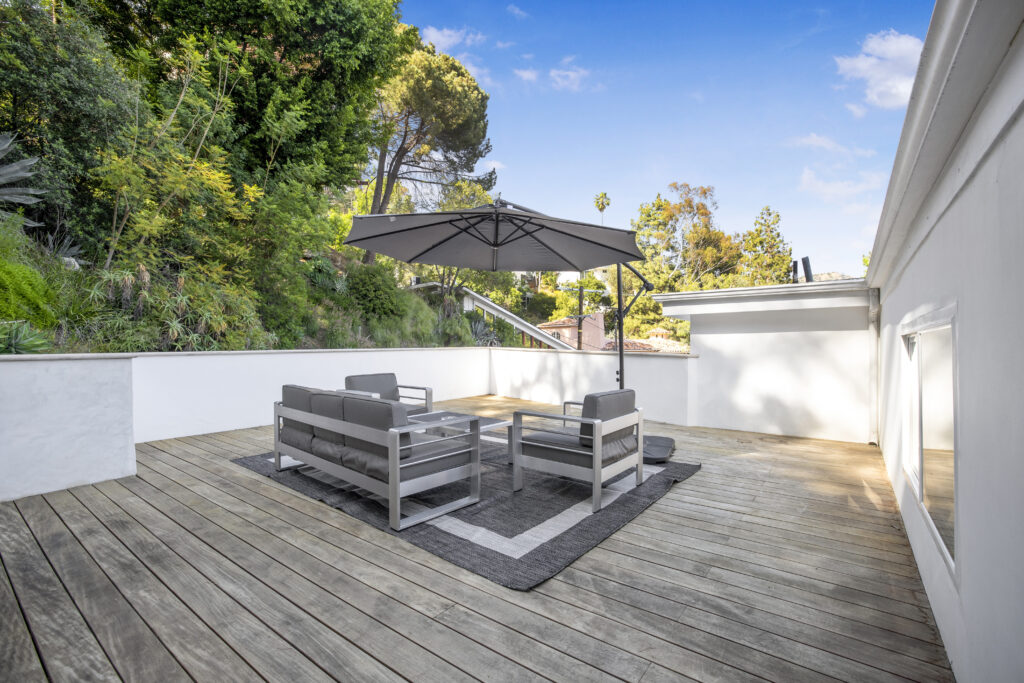 Relaxing outdoor patio deck with comfortable seating at Nichols Sanctuary.