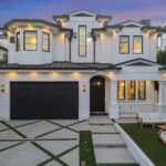 Front facade of the contemporary Los Angeles villa showing the garage entrance.