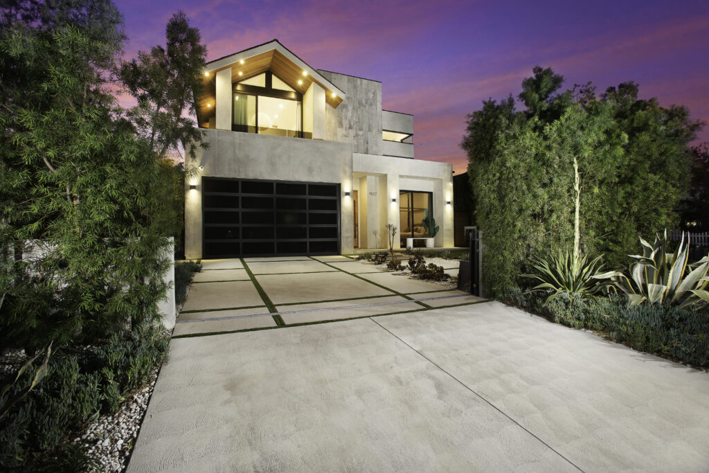Dusk view of Riverside House front facade and entry gate, luxury villa rental in Valley Village LA