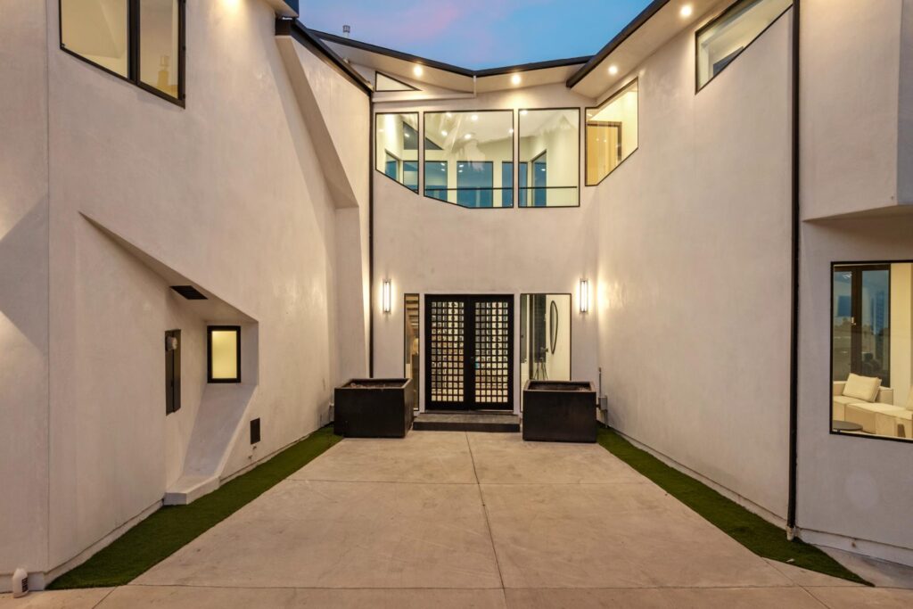 Open plan living room at Surfside Villa Malibu with high ceilings and luxury furnishings