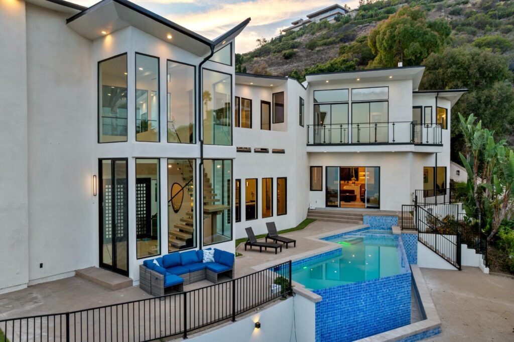 Aerial overview of pool and Pacific Ocean at Surfside Villa Malibu Southern California estate
