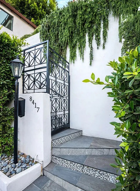 Ivy-covered entrance walkway, Spanish Casa villa