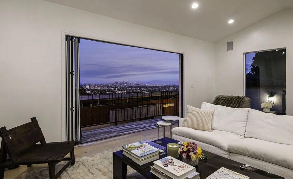 Living room with wall-mounted TV, Spanish Casa