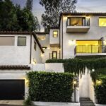 Spanish-style villa exterior with palm trees, West Hollywood