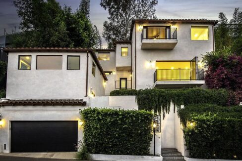 Spanish-style villa exterior with palm trees, West Hollywood