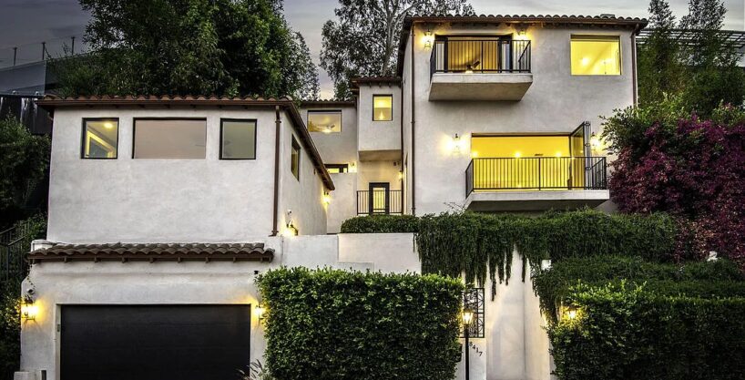 Spanish-style villa exterior with palm trees, West Hollywood