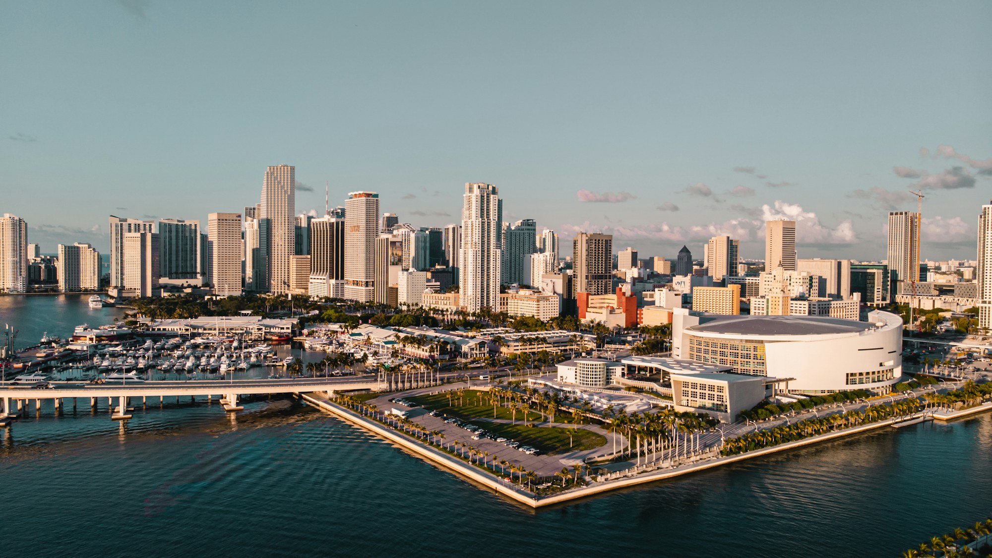 The Brickell skyline at dusk seen across Biscayne Bay