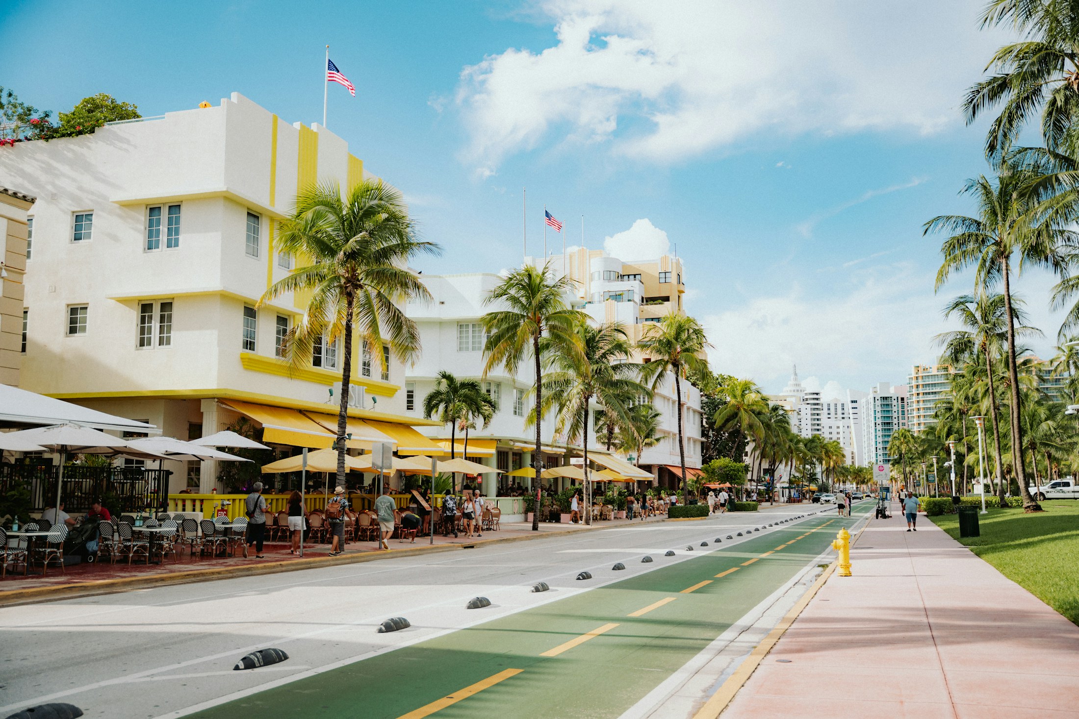 Art Deco buildings and palm trees on a Miami Beach street