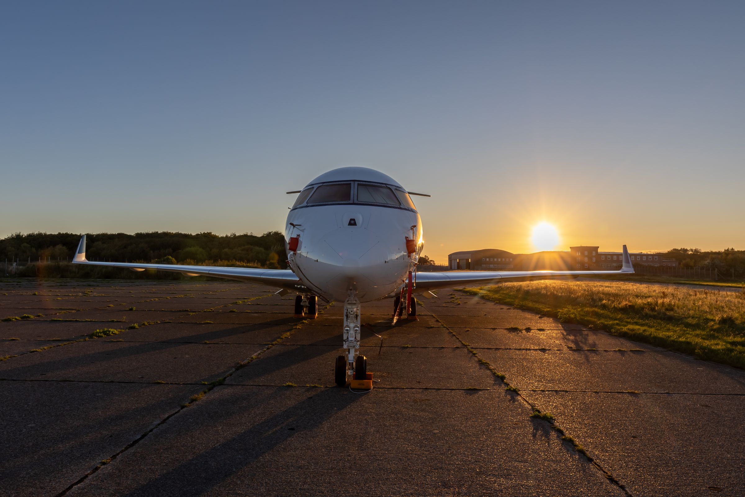 Private jet on the tarmac at golden hour